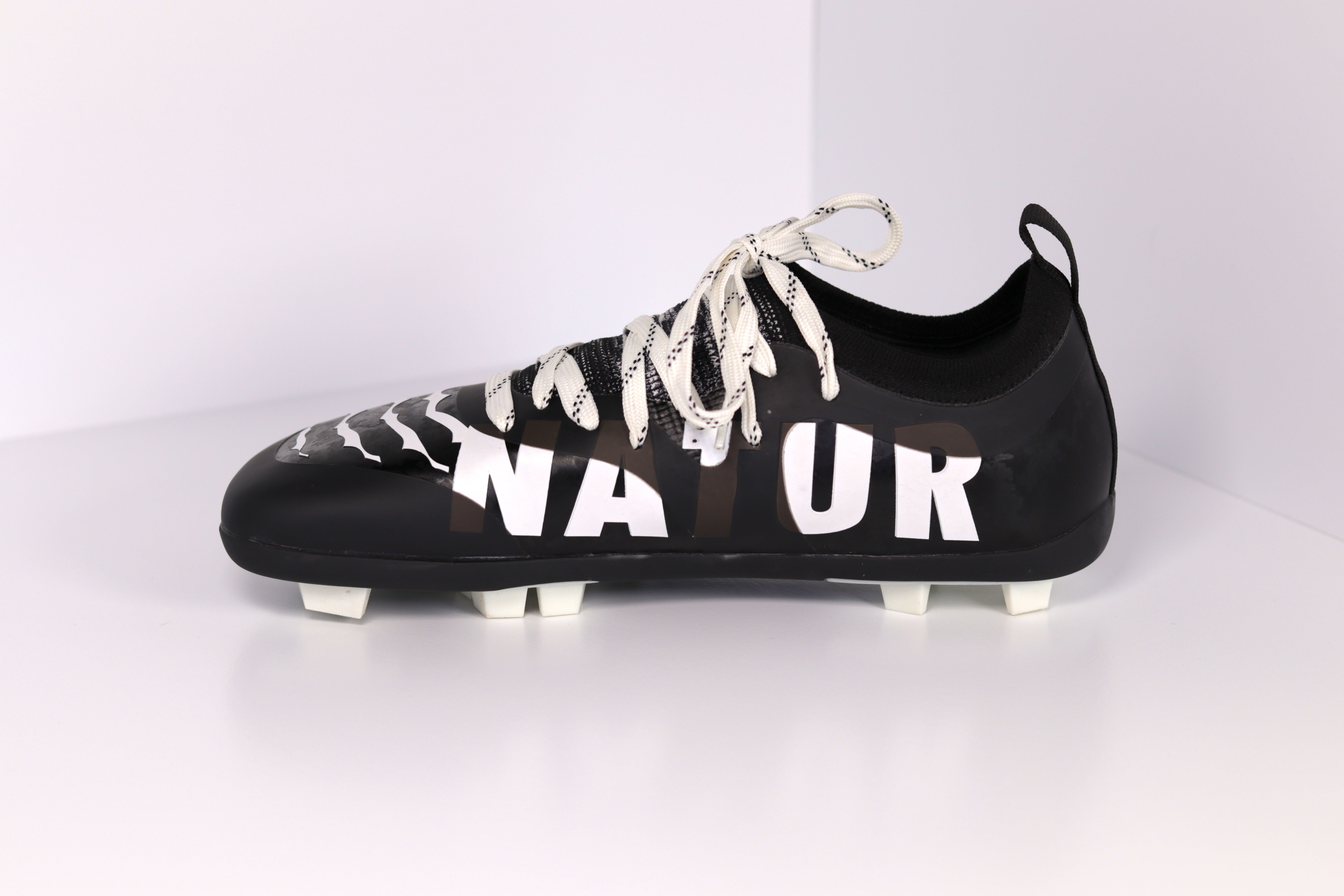 white and black football cleats